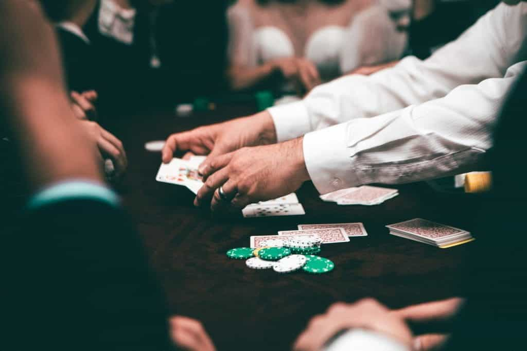 Cards being dealt in a game of poker.