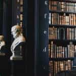 A law library features busts of famous thinkers.