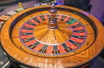 A roulette wheel spins.