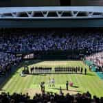 Novak Djokovic and Nick Kyrgios hold their trophies after the Men's Singles Final at Wimbledon.