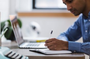 Man writing laptop.